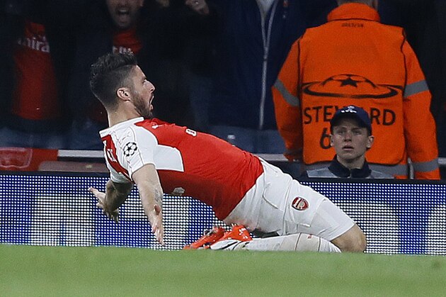 Arsenal's Olivier Giroud celebrates after scoring during the Champions League Group F soccer match between Arsenal and Bayern Munich at Emirates stadium in London Tuesday, Oct. 20, 2015. (AP Photo/Kirsty Wigglesworth)