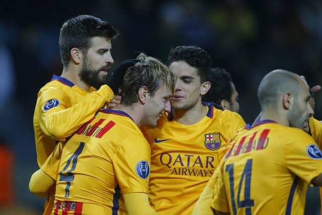 Barcelona's Ivan Rakitic, 2nd left, celebrates with team mates after scoring during a  Champions League group E soccer match between BATE Borisov and Barcelona in Borisov, Belarus,Tuesday, Oct. 20, 2015. (AP Photo/Sergei Grits)