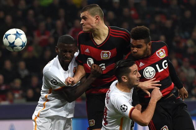 Leverkusen's Greek defender Kyriakos Papadopoulos, Leverkusen's defender Jonathan Glao Tah (R) vie with Roma´s Antonio Ruediger (L) and Kostas Manolas during the Group E, first-leg UEFA Champions League football match Bayer Leverkusen vs AS Roma in Leverkusen, western Germany on October 20, 2015. AFP PHOTO / PATRIK STOLLARZ        (Photo credit should read PATRIK STOLLARZ/AFP/Getty Images)