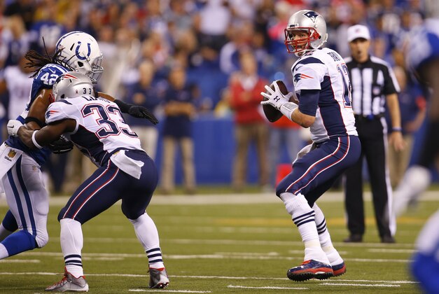 New England Patriots quarterback Tom Brady (12) looks to throw a pass against the Indianapolis Colts during an NFL football game in Indianapolis, Sunday, Oct. 18, 2015.  (Jeff Haynes/AP Images for Panini)