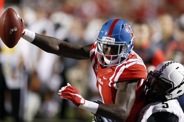 Mississippi wide receiver Laquon Treadwell (1) is tackled short of a touchdown after a pass reception defended by Vanderbilt cornerback Torren McGaster (5) in the first half of an NCAA college football game against in Oxford, Miss., Saturday, Sept. 26, 2015. (AP Photo/Rogelio V. Solis)