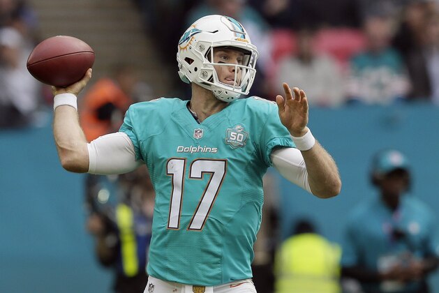 Miami Dolphins' Ryan Tannehill passes the ball during the NFL football game between the New York Jets and the Miami Dolphins and at Wembley stadium in London, Sunday, Oct. 4, 2015. (AP Photo/Tim Ireland)