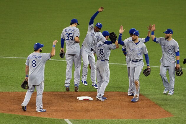TORONTO, ON - OCTOBER 20:  Eric Hosmer #35 of the Kansas City Royals and Jarrod Dyson #1 of the Kansas City Royals celebrate defeating the Toronto Blue Jays 14-2 in game four of the American League Championship Series at Rogers Centre on October 20, 2015 in Toronto, Canada.  (Photo by Vaughn Ridley/Getty Images)