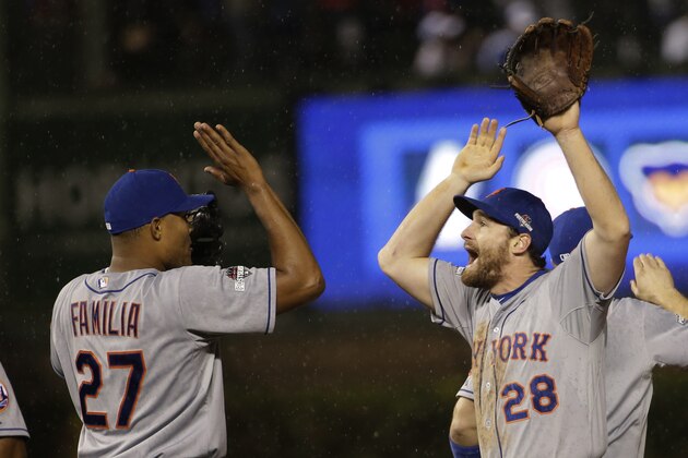 New York Mets' Daniel Murphy (28) celebrates with Jeurys Familia (27) after Game 3 of the National League baseball championship series against the Chicago Cubs Tuesday, Oct. 20, 2015, in Chicago. The Mets won 5-2 to take a 3-0 lead in the series. (AP Photo/David J. Phillip)