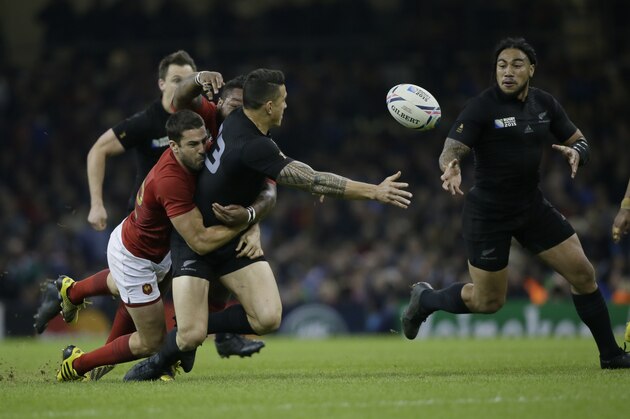 New Zealand's Sonny Bill Williams passes the ball during the Rugby World Cup quarterfinal match between New Zealand and France at the Millennium Stadium, Cardiff, Saturday, Oct. 17, 2015. (AP Photo/Tim Ireland)