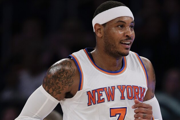 New York Knicks forward Carmelo Anthony smiles after hitting a three-point shot against Paschoalotto Bauru during the first half of a preseason exhibition basketball game, Wednesday, Oct. 7, 2015, in New York. The Knicks won 100-81. (AP Photo/Julie Jacobson)