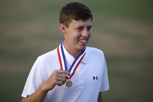 Amateur, Matthew Fitzpatrick, England, poses with the low amateur medal after the U.S. Open golf tournament in Pinehurst, N.C., Sunday, June 15, 2014. Martin Kaymer, of Germany, won. (AP Photo/David Goldman)