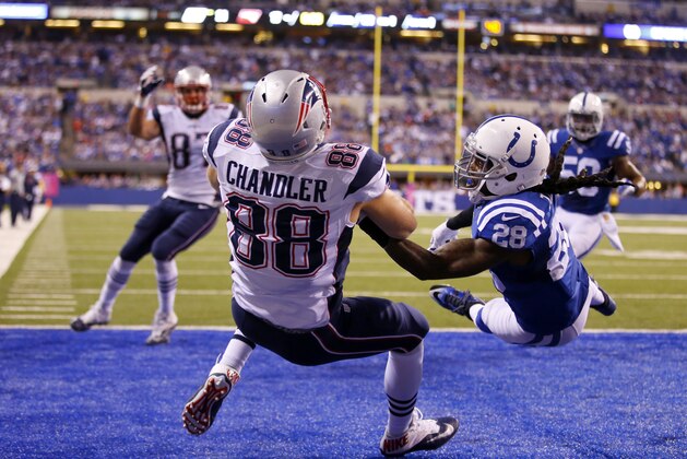 New England Patriots tight end Scott Chandler (88) makes a catch over Indianapolis Colts cornerback Greg Toler (28) in the end zone in the first half of an NFL football game in Indianapolis, Sunday, Oct. 18, 2015. Offensive pass interference was called on the play.  (Jeff Haynes/AP Images for Panini)
