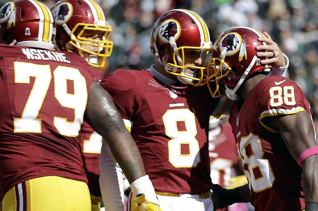 Washington Redskins quarterback Kirk Cousins (8) celebrates with wide receiver Pierre Garcon (88) after Garcon caught a touchdown pass from him against the New York Jets during the first half of an NFL football game, Sunday, Oct. 18, 2015, in East Rutherford, N.J. (AP Photo/Seth Wenig) Washington Redskins quarterback Kirk Cousins (8) celebrates with wide receiver Pierre Garcon (88) after Garcon caught a touchdown pass from him against the New York Jets during the first half of an NFL football game, Sunday, Oct. 18, 2015, in East Rutherford, N.J. (AP Photo/Seth Wenig)