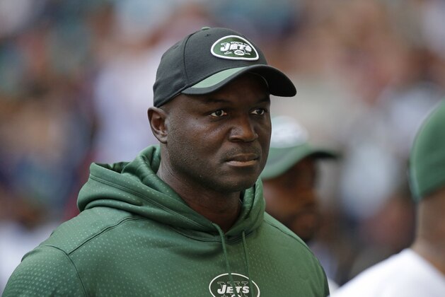 New York Jets head coach Todd Bowles watches the warm-up before the NFL football game between the New York Jets and the Miami Dolphins and at Wembley stadium in London, Sunday, Oct. 4, 2015. (AP Photo/Matt Dunham)