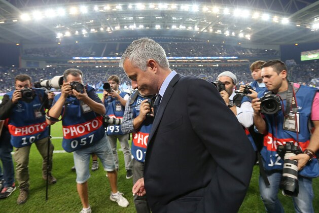 Photographers swarm Chelsea manager Jose Mourinho on the sidelines during the Champions League group G soccer match between FC Porto and Chelsea FC at the Dragao stadium in Porto, Portugal, Tuesday, Sept. 29, 2015.  Porto won 2-1. (AP Photo/Steven Governo)