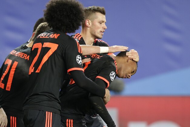 Manchester United's Anthony Martial, right, celebrates with team mates after scoring an equalizer during the Champions League Group B soccer match between CSKA Moscow and Manchester United at the Arena Khimki stadium in Moscow, Russia, on Wednesday, Oct. 21, 2015. (AP Photo/Pavel Golovkin)