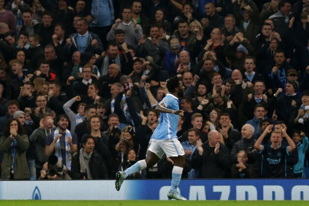 Manchester City's Wilfried Bony celebrates after scoring his sides first goal against Sevilla during the Champions League Group D soccer match between Manchester City and Sevilla at the Etihad Stadium, Manchester, England, Wednesday, Oct. 21, 2015. (AP Photo/Clint Hughes)