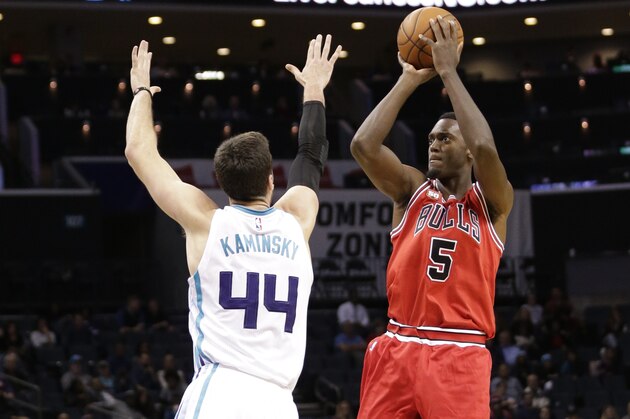 Chicago Bulls' Bobby Portis (5) shoots over Charlotte Hornets' Frank Kaminsky (44) in the second half of an NBA preseason basketball game in Charlotte, N.C., Monday, Oct. 19, 2015. The Hornets won 94-86. (AP Photo/Chuck Burton)