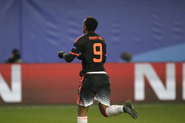 Manchester United's Anthony Martial celebrates with team mates after scoring an equalizer during the Champions League Group B soccer match between CSKA Moscow and Manchester United at the Arena Khimki stadium in Moscow, Russia, on Wednesday, Oct. 21, 2015. (AP Photo/Pavel Golovkin)