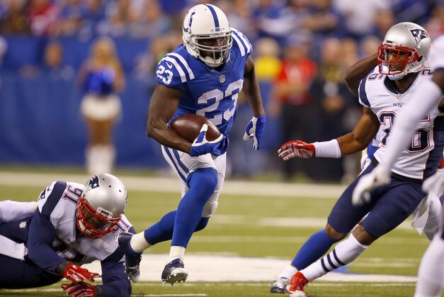 Indianapolis Colts running back Frank Gore (23) runs the ball against the New England Patriots during an NFL football game in Indianapolis, Sunday, Oct. 18, 2015.  (Jeff Haynes/AP Images for Panini)