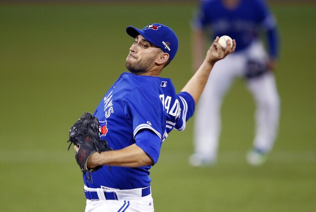 Toronto Blue Jays starting pitcher Marco Estrada throws against the Kansas City Royals during the eighth inning in Game 5 of baseball's American League Championship Series on Wednesday, Oct. 21, 2015, in Toronto. (AP Photo/Paul Sancya)