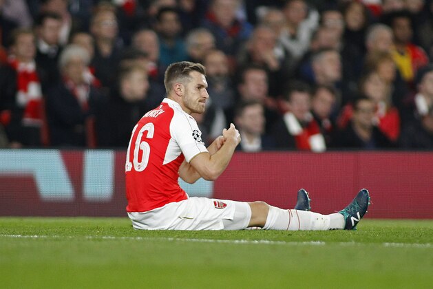 LONDON, ENGLAND - OCTOBER 20: Aaron Ramsey of Arsenal signals to the bench that he needs to be substituted during the UEFA Champions League match between Arsenal and Bayern Munich at The Emirates Stadium on October 20, 2015 in London, United Kingdom. (Photo by Mitchell Gunn/Getty Images)