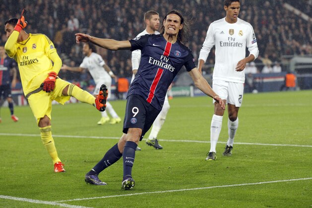 PSG's Edinson Cavani reacts after missing a chance to score during the Champions League group A soccer match between Paris St Germain and Real Madrid at the Parc des Princes stadium in Paris, Wednesday, Oct. 21, 2015. (AP Photo/Michel Euler)