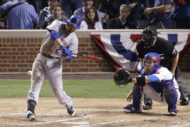 New York Mets' Lucas Duda hits a two-run scoring double during the second inning of Game 4 of the National League baseball championship series against the Chicago Cubs Wednesday, Oct. 21, 2015, in Chicago. (AP Photo/David Goldman)