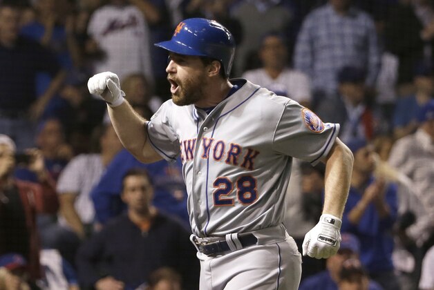 New York Mets' Daniel Murphy celebrates after hitting a two-run home run during the eighth inning of Game 4 of the National League baseball championship series against the Chicago Cubs Wednesday, Oct. 21, 2015, in Chicago. (AP Photo/David J. Phillip)