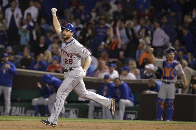 New York Mets' Daniel Murphy celebrates after hitting a two-run home run during the eighth inning of Game 4 of the National League baseball championship series against the Chicago Cubs Wednesday, Oct. 21, 2015, in Chicago. (AP Photo/Nam Y. Huh)
