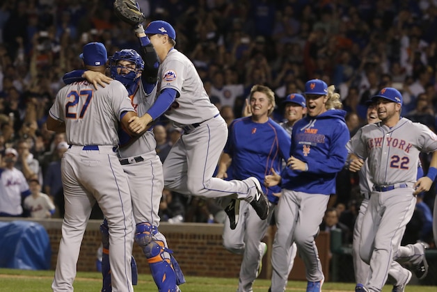 The New York Mets celebrate after Game 4 of the National League baseball championship series against the Chicago Cubs Wednesday, Oct. 21, 2015, in Chicago. The Mets won 8-3 to advance to the World Series. (AP Photo/Nam Y. Huh)