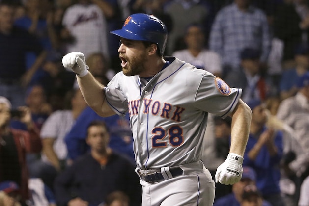 New York Mets' Daniel Murphy celebrates after hitting a two-run home run during the eighth inning of Game 4 of the National League baseball championship series against the Chicago Cubs Wednesday, Oct. 21, 2015, in Chicago. (AP Photo/David J. Phillip)