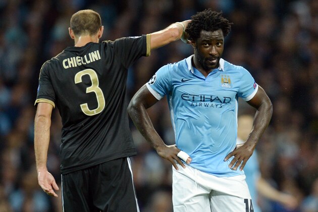 Manchester City's Ivorian striker Wilfried Bony (R) reacts after missing a shot on goal during a UEFA Champions League group stage football match between Manchester City and Juventus at the Etihad stadium in Manchester, north-west England on September 15, 2015.       AFP PHOTO / OLI SCARFF        (Photo credit should read OLI SCARFF/AFP/Getty Images)