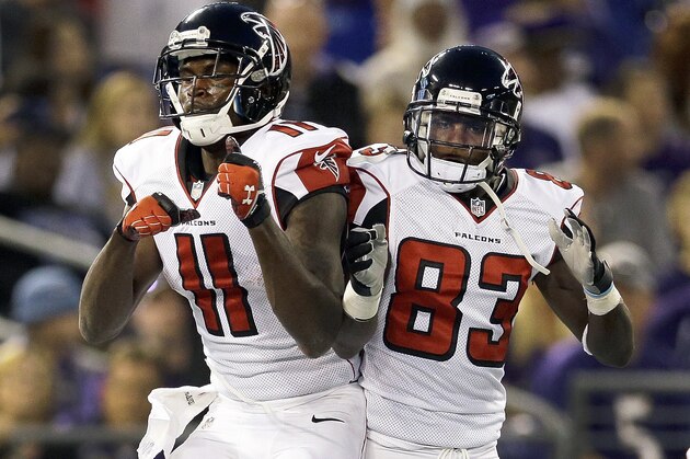 Atlanta Falcons wide receiver Julio Jones, left, celebrates his touchdown with wide receiver Harry Douglas during the first half of a preseason NFL football game against the Baltimore Ravens in Baltimore, Thursday Aug. 15, 2013. (AP Photo/Patrick Semansky)
