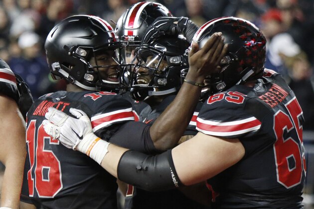 Ohio State quaterback J.T. Barrett (16), Braxton Miller (1) and Pat Elflein (65)celebrate Millers touchdown against  Penn State during an NCAA college football game Saturday, Oct. 17, 2015, in Columbus, Ohio. Ohio State beat Penn State 38-10. (AP Photo/Paul Vernon)