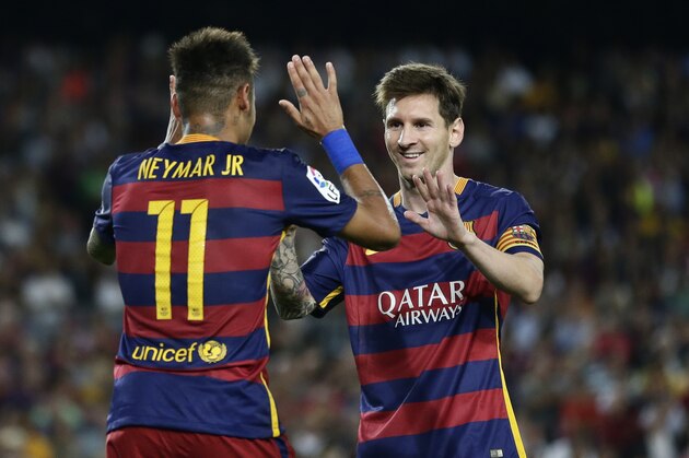 FC Barcelona's Lionel Messi, left, celebrates after scoring with teammate Neymar during a Spanish La Liga soccer match against Levante at the Camp Nou stadium in Barcelona, Spain, Sunday, Sept. 20, 2015. (AP Photo/Manu Fernandez)