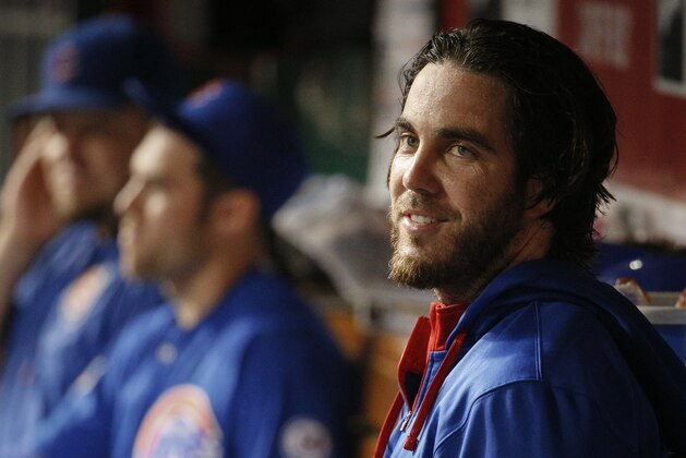 Chicago Cubs starting pitcher Dan Haren smiles in the dugout in the eighth inning of a baseball game against the Cincinnati Reds, Wednesday, Sept. 30, 2015, in Cincinnati. (AP Photo/John Minchillo)