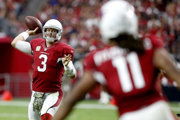 Arizona Cardinals quarterback Carson Palmer (3) throws to Larry Fitzgerald (11) during the first half of an NFL football game against the St. Louis Rams, Sunday, Nov. 9, 2014, in Glendale, Ariz. (AP Photo/Ross D. Franklin)