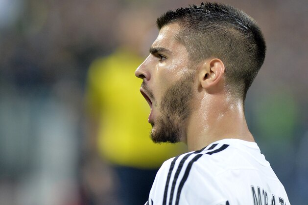 Juventus Alvaro Morata celebrates after he scored during the Champions League group D soccer match between Juventus and FC Sevilla, at the Juventus Stadium in Turin, Italy, Wednesday, Sept. 30, 2015. (AP Photo/Massimo Pinca)