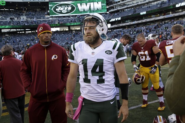 New York Jets quarterback Ryan Fitzpatrick walks on the field after an NFL football game against the Washington Redskins, Sunday, Oct. 18, 2015, in East Rutherford, N.J. The Jets won 34-20. (AP Photo/Seth Wenig)