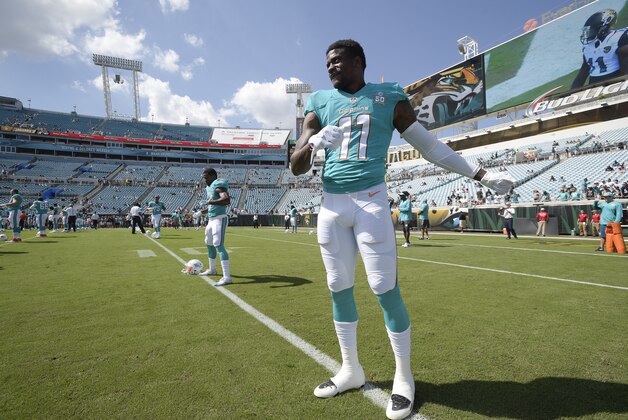 Miami Dolphins wide receiver DeVante Parker (11) warms up before an NFL football game against the Jacksonville Jaguars in Jacksonville, Fla., Sunday, Sept. 20, 2015.(AP Photo/Phelan M. Ebenhack)