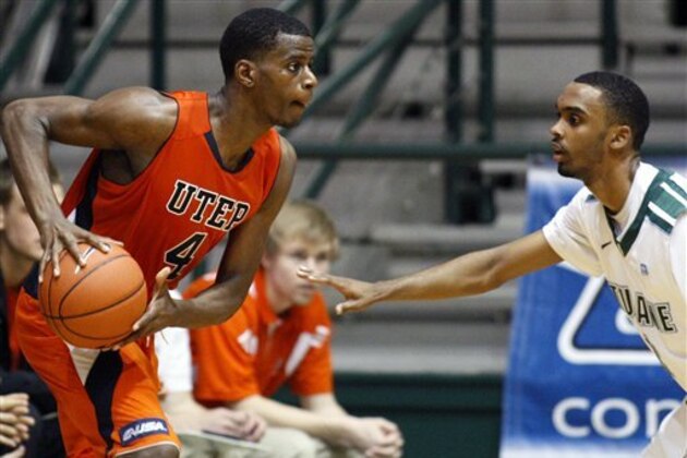 UTEP's Julian Washburn (4) drives against Tulane's Ricky Tarrant, right, during the second half of an NCAA college basketball game in New Orleans, Saturday, Jan. 21, 2012. Tulane won 66-58.(AP Photo/Jonathan Bachman) UTEP's Julian Washburn (4) drives against Tulane's Ricky Tarrant, right, during the second half of an NCAA college basketball game in New Orleans, Saturday, Jan. 21, 2012. Tulane won 66-58.(AP Photo/Jonathan Bachman)