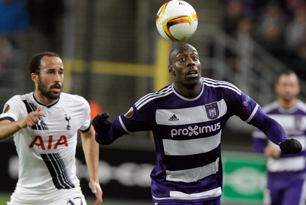 Anderlecht's Stefano Okaka, center, is chased by Tottenham's Andros Townsend during the Europa League Group J soccer match between Tottenham and Anderlecht at Constant Vanden Stock stadium in Brussels, on Thursday Oct 22, 2015. (AP Photo/Francois Walschaerts)
