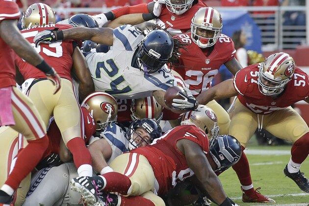 Seattle Seahawks running back Marshawn Lynch (24) runs for a 1-yard touchdown against the San Francisco 49ers during the first half of an NFL football game in Santa Clara, Calif., Thursday, Oct. 22, 2015. (AP Photo/Marcio Jose Sanchez)