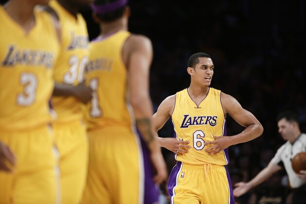 Los Angeles Lakers' Jordan Clarkson walks on the court during the first half of an NBA preseason basketball game against the Portland Trail Blazers, Monday, Oct. 19, 2015, in Los Angeles. (AP Photo/Jae C. Hong)