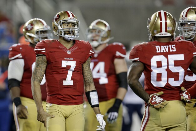 San Francisco 49ers quarterback Colin Kaepernick (7) stands next to tight end Vernon Davis (85) during the second half of an NFL football game against the San Diego Chargers in Santa Clara, Calif., Saturday, Dec. 20, 2014. (AP Photo/Ben Margot)