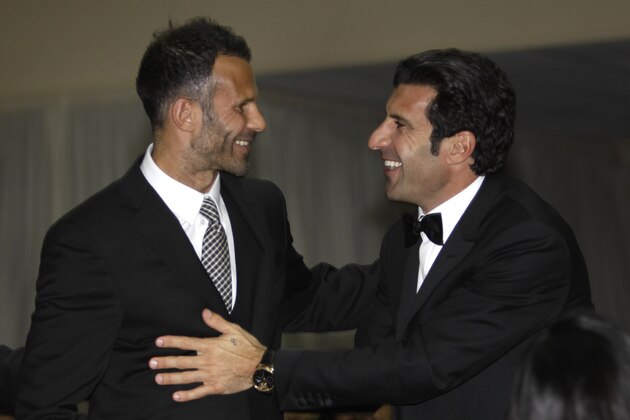 Former soccer player Luis Figo of Portugal, right, congratules soccer player Ryan Giggs of Wales for his Golden foot award 2011 during the ceremony of the