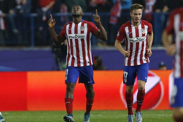 Atletico's Jackson Martinez, left,  celebrates next to teammate Saul Niguez after scoring his side’s second goal during the Champions League group C soccer match between Atletico Madrid and Astana at the Vicente Calderon stadium in Madrid, Wednesday, Oct. 21, 2015.  (AP Photo/Daniel Ochoa de Olza)