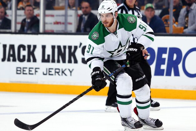 Dallas Stars' Tyler Seguin carries the puck against the Boston Bruins during the third period of the Dallas Stars 5-3 win over the Boston Bruins in an NHL hockey game in Boston Tuesday, Feb. 10, 2015. (AP Photo/Winslow Townson)