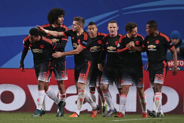Manchester United's Anthony Martial, second left, celebrates after scoring his side's first goal during the Champions League Group B soccer match between CSKA Moscow and Manchester United at the Arena Khimki stadium in Moscow, Russia, on Wednesday, Oct. 21, 2015. (AP Photo/Ivan Sekretarev)