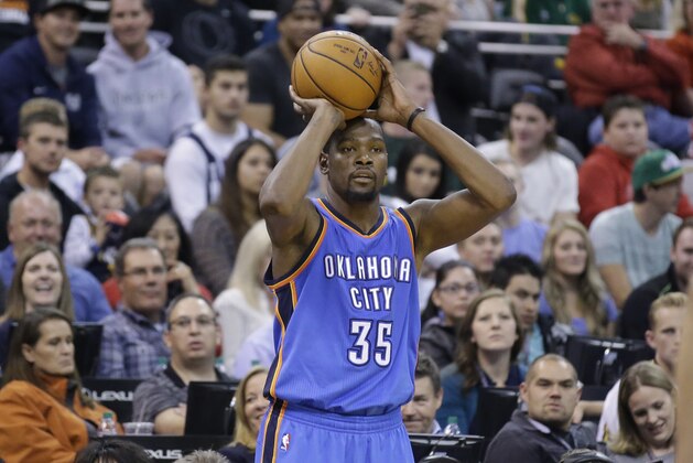 Oklahoma City Thunder forward Kevin Durant (35) passes the ball in the second half during an NBA preseason basketball game against the Utah Jazz Tuesday, Oct. 20, 2015, in Salt Lake City. The Thunder won 113-102. (AP Photo/Rick Bowmer)