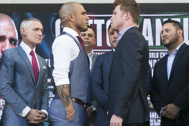 Boxers Miguel Cotto, from Puerto Rico, second from left, WBC, Ring Magazine and Lineal Middleweight World Champion and Saul Boxers Miguel Cotto, from Puerto Rico, second from left, WBC, Ring Magazine and Lineal Middleweight World Champion and Saul