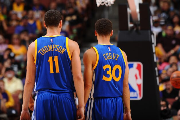 ANAHEIM, CA - OCTOBER 22:  Klay Thompson #11 of the Golden State Warriors and Stephen Curry #30 of the Golden State Warriors looks on during a preseason game against the Los Angeles Lakers on October 22, 2015 at Honda Center in Anaheim, California. NOTE TO USER: User expressly acknowledges and agrees that, by downloading and/or using this Photograph, user is consenting to the terms and conditions of the Getty Images License Agreement. Mandatory Copyright Notice: Copyright 2015 NBAE (Photo by Juan Ocampo/NBAE via Getty Images)