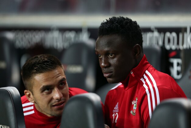 MILTON KEYNES, ENGLAND - SEPTEMBER 23:  Victor Wanyama and Dusan Tadic of Southampton on the bench before the Capital One Cup third round match between MK Dons and Southampton at Stadium mk on September 23, 2015 in Milton Keynes, England.  (Photo by Catherine Ivill - AMA/Getty Images)